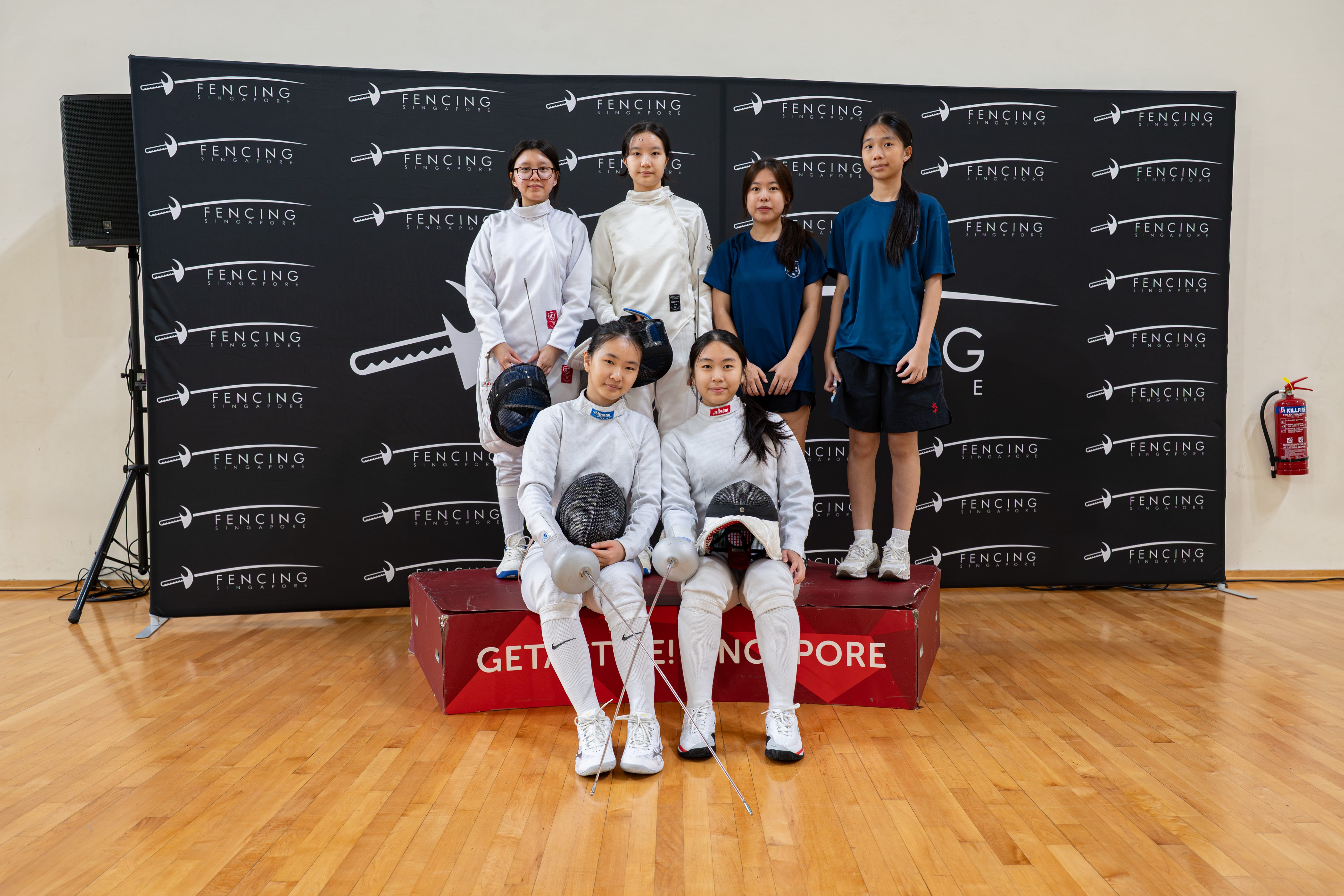 fencers posing for a photo